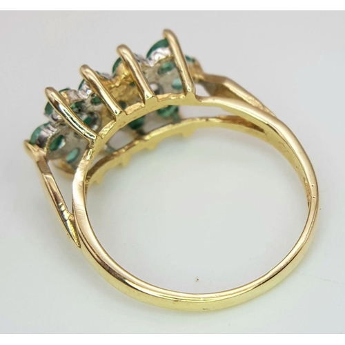 495 - A 9K YELLOW GOLD DOUBLE DIAMOND & EMERALD CLUSTER RING. 2.4G IN WEIGHT. SIZE K AND 1/2. Ref: 8034