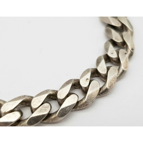 519 - A Classic Sterling Silver Curb Bracelet. 20cm. 24g weight.