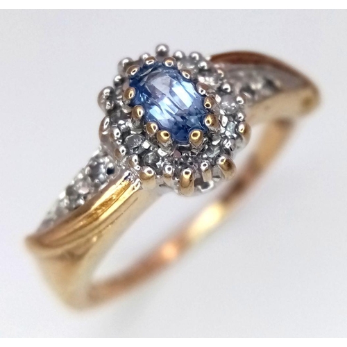 600 - A 9K YELLOW GOLD DIAMOND & TOPAZ RING. 2.5G IN WEIGHT. SIZE K AND 1/2. Ref: SC 6042