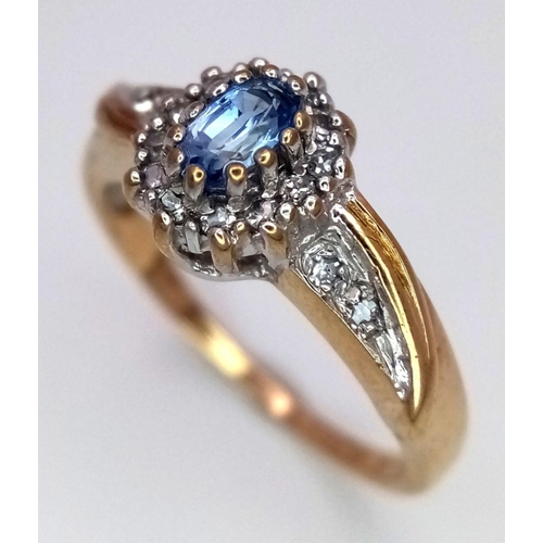 600 - A 9K YELLOW GOLD DIAMOND & TOPAZ RING. 2.5G IN WEIGHT. SIZE K AND 1/2. Ref: SC 6042