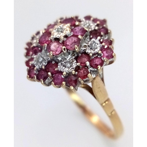 642 - A 9K YELLOW GOLD DIAMOND & RUBY CLUSTER RING 3.7G SIZE S. Ref: SC 6015