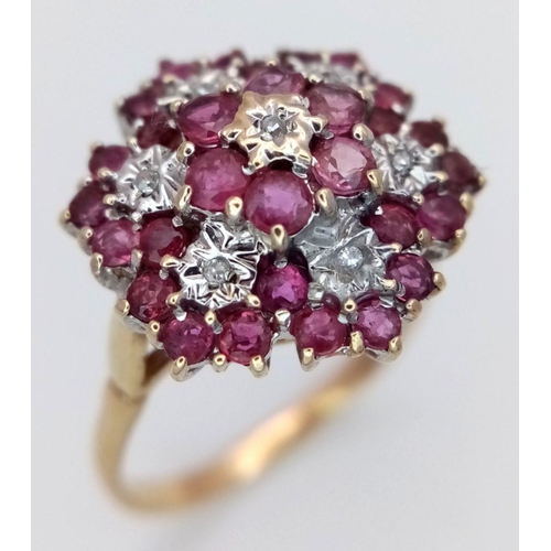 642 - A 9K YELLOW GOLD DIAMOND & RUBY CLUSTER RING 3.7G SIZE S. Ref: SC 6015