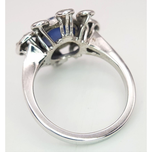 67 - AN 18K WHITE GOLD DIAMOND & STAR SAPPHIRE RING. 6.3G IN WEIGHT. SIZE O AND 1/2. Ref: 8808