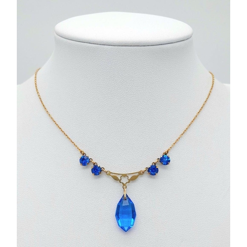 876 - A Vintage 9K Yellow Gold Blue Stone Lavaliere Necklace. 40cm length. 3.2g total weight.