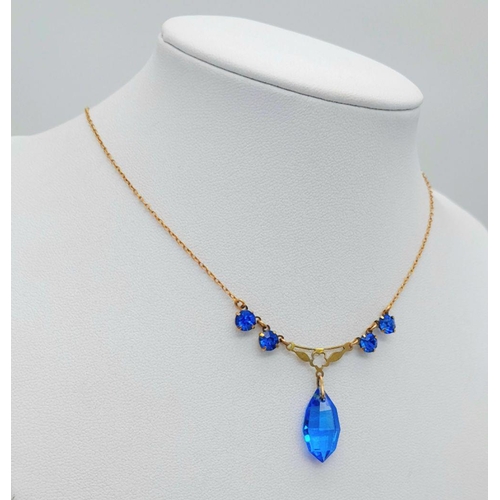 876 - A Vintage 9K Yellow Gold Blue Stone Lavaliere Necklace. 40cm length. 3.2g total weight.