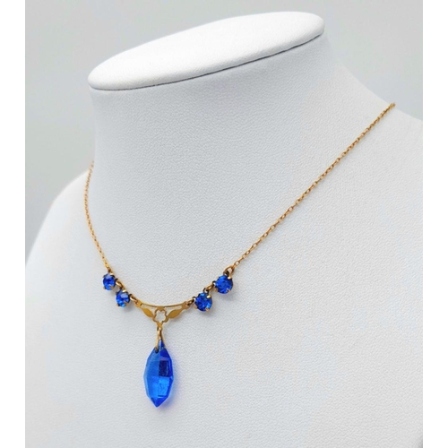 876 - A Vintage 9K Yellow Gold Blue Stone Lavaliere Necklace. 40cm length. 3.2g total weight.