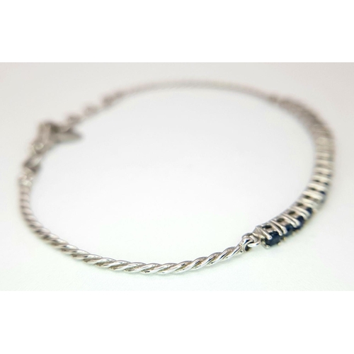 88 - AN 18K WHITE GOLD DIAMOND & SAPPHIRE BRACELET. 5.1G IN WEIGHT. APPROX. 17.5CM IN LENGTH. Ref: SC 610... 