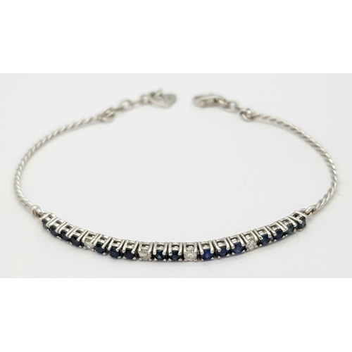 88 - AN 18K WHITE GOLD DIAMOND & SAPPHIRE BRACELET. 5.1G IN WEIGHT. APPROX. 17.5CM IN LENGTH. Ref: SC 610... 