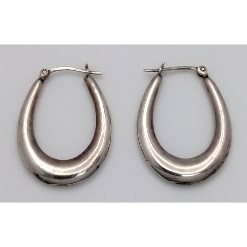 1342 - A PAIR OF STERLING SILVER OVAL SHAPED HOOP EARRINGS-3.7G. SC5075