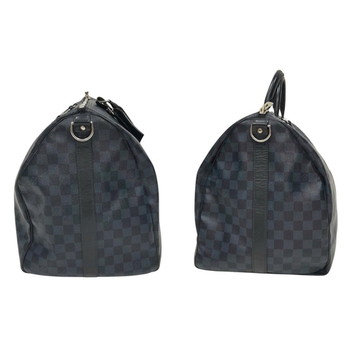 645 - A Louis Vuitton Blue and Black Damier Keepall 55 Bag. Blue and black Damier canvas exterior with bla... 