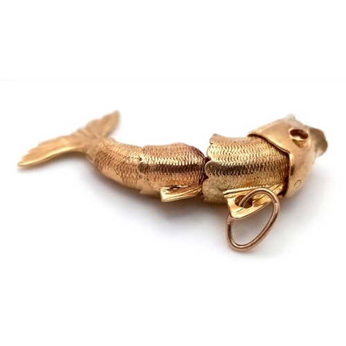 211 - A 9K Yellow Gold Articulated Leaping Fish Pendant! 4cm. 6.22g weight.