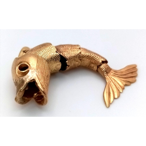 211 - A 9K Yellow Gold Articulated Leaping Fish Pendant! 4cm. 6.22g weight.