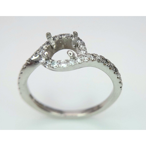 250 - A PLATINUM DIAMOND TWIST RING MOUNT READY TO SET YOUR DREAM STONE IN HOLDS A 0.70CT ROUND BRILIANT S... 