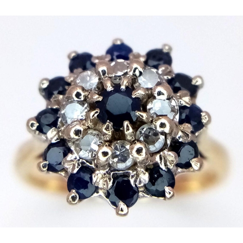 285 - A 18K YELLOW GOLD DIAMOND & SAPPHIRE CLUSTER RING 4.1G SIZE J 1/2. Ref: SC 6084