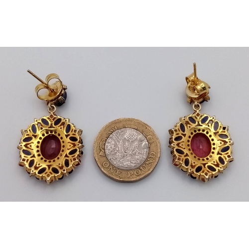 373 - A pair of 925 Silver Ruby and Kyanite Earrings, featuring a central ruby surrounded by kyanite stone... 