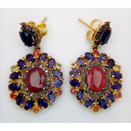 373 - A pair of 925 Silver Ruby and Kyanite Earrings, featuring a central ruby surrounded by kyanite stone... 