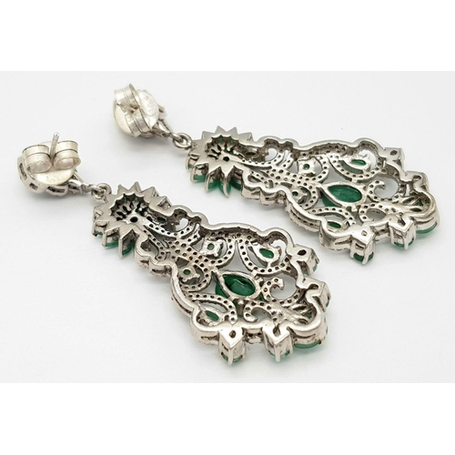 401 - A pair 925 silver Emerald and Diamond Dangler Earrings. 12.1cts of emeralds and 2.65cts of diamonds.... 