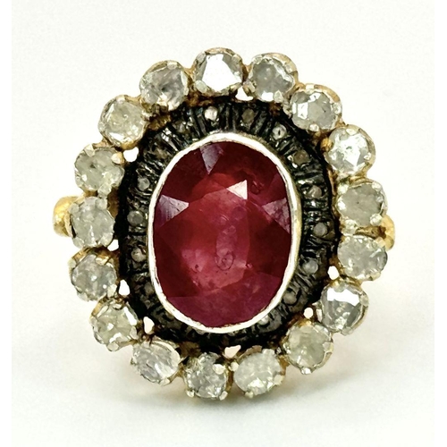 415 - A 10.2ct Ruby Gemstone Ring with a halo of 1ct round diamonds and 2ct flat Polki diamonds, set in 92... 