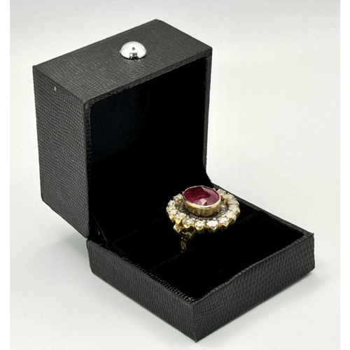 415 - A 10.2ct Ruby Gemstone Ring with a halo of 1ct round diamonds and 2ct flat Polki diamonds, set in 92... 