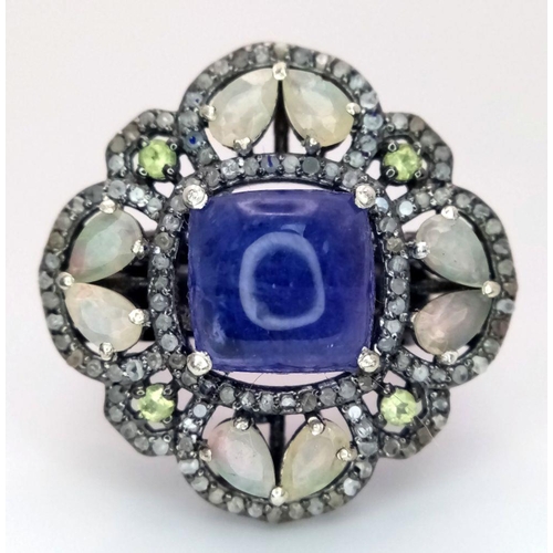 422 - A 5.10ct Cabochon Tanzanite Ring with 2.3ct diamond accents and 3ct moonstone, set in 925 silver. To... 