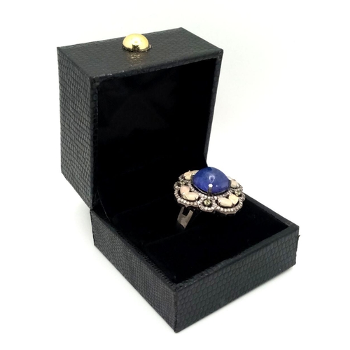 422 - A 5.10ct Cabochon Tanzanite Ring with 2.3ct diamond accents and 3ct moonstone, set in 925 silver. To... 