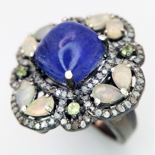 422 - A 5.10ct Cabochon Tanzanite Ring with 2.3ct diamond accents and 3ct moonstone, set in 925 silver. To... 