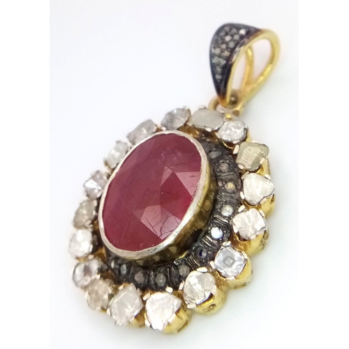 429 - A 925 Silver Ruby Pendant Necklace featuring a 10.5ct central ruby surrounded by approximately 1.8ct... 