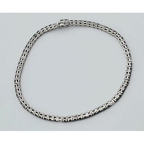 47 - A 18K WHITE GOLD BLACK & WHITE DIAMOND TENNIS BRACELET 2.10CT 7.9G , 17.6CM IN LENGTH. Ref: SC 6076