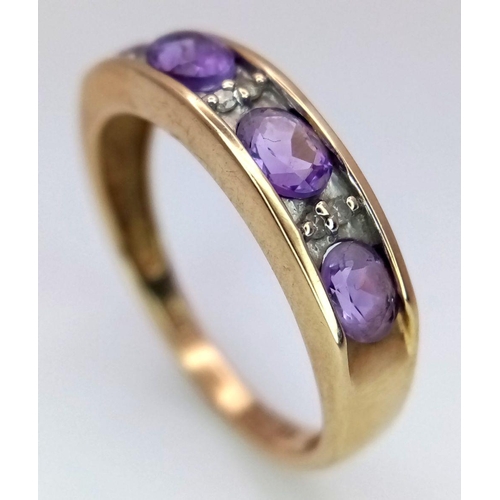 509 - A 9K YELLOW GOLD DIAMOND & AMETHYST BAND RING. 1.7G IN WEIGHT. SIZE L. Ref: 7034