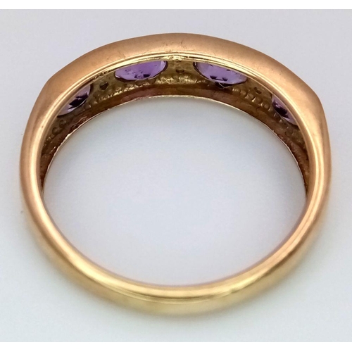 509 - A 9K YELLOW GOLD DIAMOND & AMETHYST BAND RING. 1.7G IN WEIGHT. SIZE L. Ref: 7034