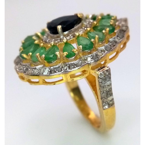 513 - An Emerald and Sapphire Ring, featuring approximately 1.5ct emeralds and 2.65cts of diamonds, set in... 