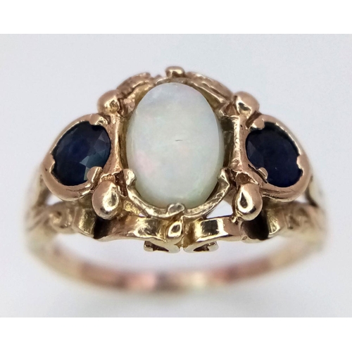 516 - A 9K YELLOW GOLD SAPPHIRE & OPAL RING. 2.7G IN WEIGHT. SIZE J. Ref: 8404.