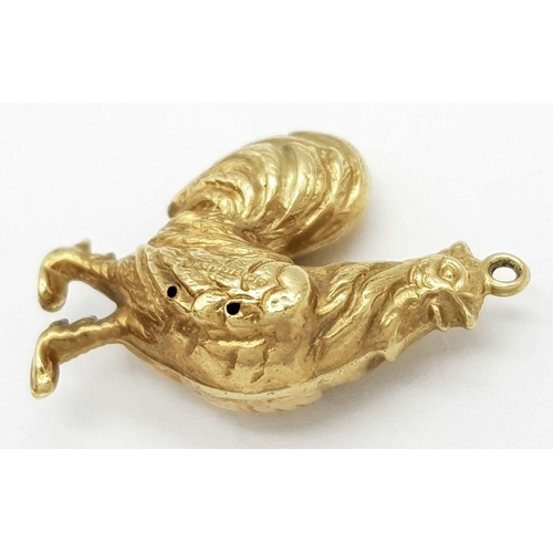 533 - A 9K Yellow Gold Cock. This cock can be hung from a necklace or dangled from a bracelet. 25mm. 1.7g ... 