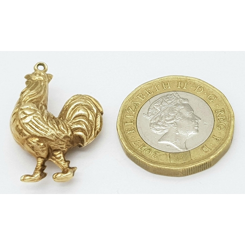 533 - A 9K Yellow Gold Cock. This cock can be hung from a necklace or dangled from a bracelet. 25mm. 1.7g ... 