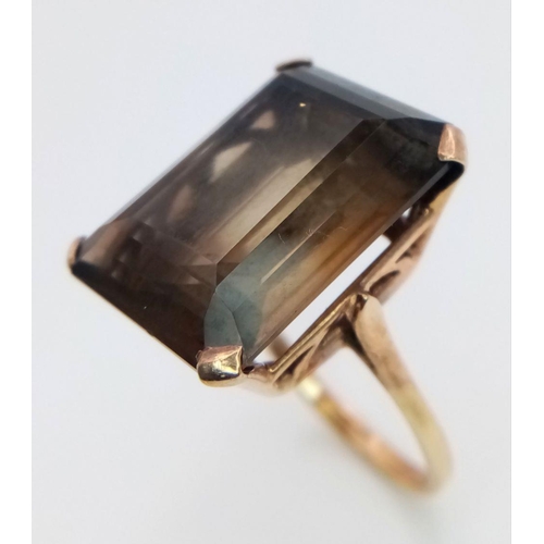 647 - A Vintage 9K Yellow Gold Smoky Quartz Ring. Large rectangular step-cut smoky quartz. Size P 1/2. 7.2... 