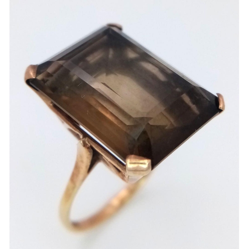 647 - A Vintage 9K Yellow Gold Smoky Quartz Ring. Large rectangular step-cut smoky quartz. Size P 1/2. 7.2... 