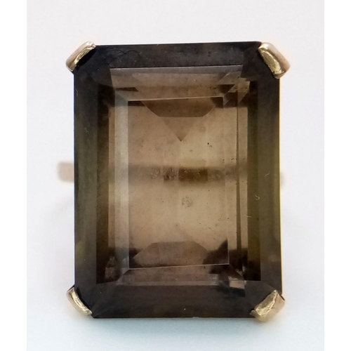 647 - A Vintage 9K Yellow Gold Smoky Quartz Ring. Large rectangular step-cut smoky quartz. Size P 1/2. 7.2... 