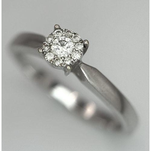 691 - A 9K WHITE GOLD DIAMOND RING 0.15CT 2.2G SIZE M. Ref: SC 6017