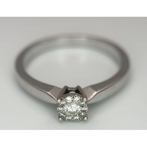 691 - A 9K WHITE GOLD DIAMOND RING 0.15CT 2.2G SIZE M. Ref: SC 6017