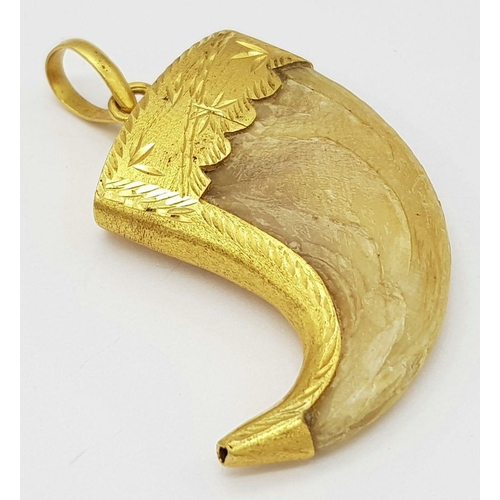 232 - Withdrawn - An Antique 22k Gold (tested) Tigers Claw Pendant. 17g total weight. 6cm x 4cm.