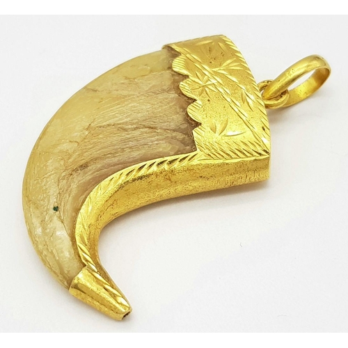 232 - Withdrawn - An Antique 22k Gold (tested) Tigers Claw Pendant. 17g total weight. 6cm x 4cm.