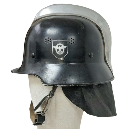 279 - A WW2 German “Feuerwehr” Firefighters Helmet. Complete with decals, chin strap and nape protector.