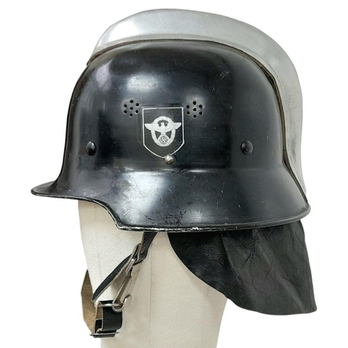 279 - A WW2 German “Feuerwehr” Firefighters Helmet. Complete with decals, chin strap and nape protector.