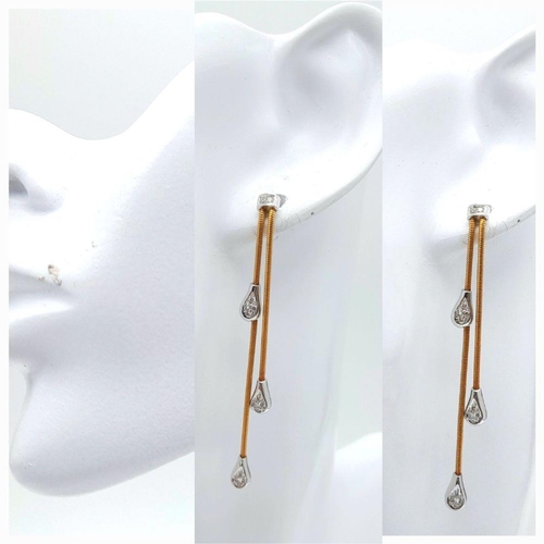 53 - A PAIR OF 18K 2 COLOUR DIAMOND SET 2 ROW TASSLE DROP EARRINGS. 7.7G IN WEIGHT. APPROX. 6CM IN LENGTH... 