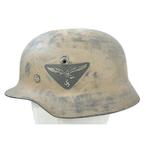 96 - A WW2 German M40 single decal Luftwaffe Africa Corps Helmet. Wirh liner.