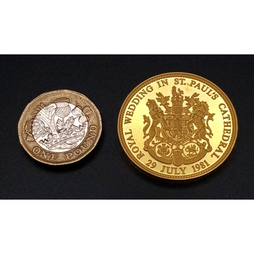 10 - A 22K GOLD COMMEMORATIVE COIN OF CHARLES AND DIANA'S WEDDING IN JULY 1981 , WEGHING 34.06gms  AND IN... 