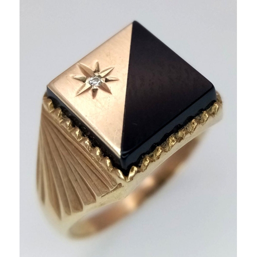 206 - A 9K GOLD GENTS SIGNET RING WITH FANCY SHOULDERS AND A HALF ONYX AND DIAMOND SUNBURST FACE.     3gms... 