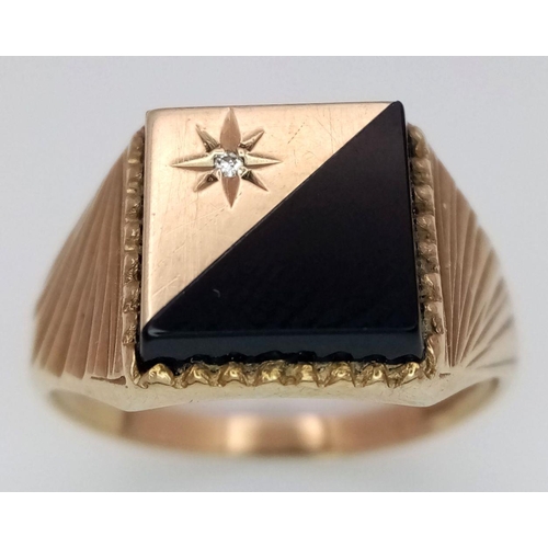 206 - A 9K GOLD GENTS SIGNET RING WITH FANCY SHOULDERS AND A HALF ONYX AND DIAMOND SUNBURST FACE.     3gms... 