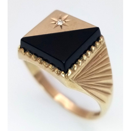 206 - A 9K GOLD GENTS SIGNET RING WITH FANCY SHOULDERS AND A HALF ONYX AND DIAMOND SUNBURST FACE.     3gms... 