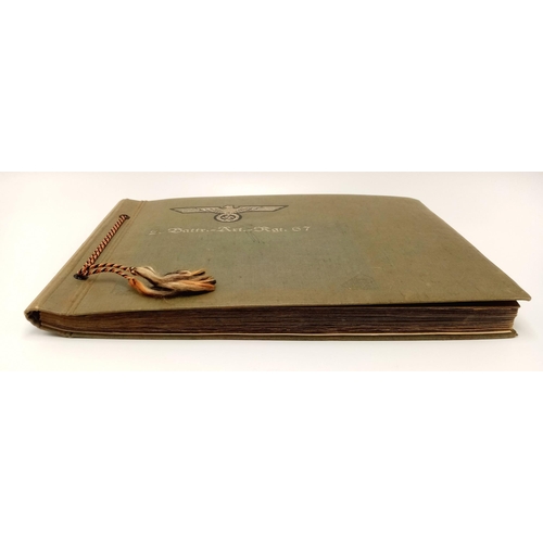 384 - A WW2 German Photo Album from a soldier in the 2nd Battery Artillery. A good selection of photos inc... 